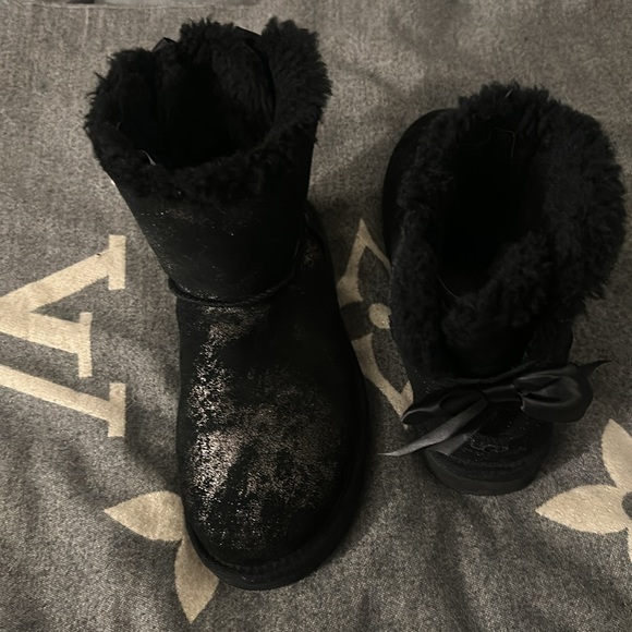 UGGs for sale. Women’s size 7. They are black with gold and a bow on the back. - Picture 5 of 6